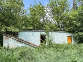 Имущественный комплекс в составе земельного участка общей площадью 11 618 кв.м. и 8 зданий и сооружений общей площадью 983,5 кв.м.